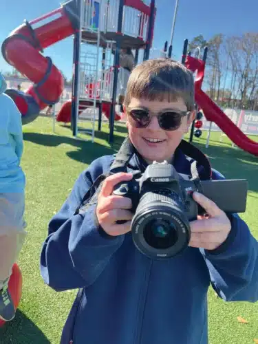 Video and audio producer Zac Hooks shows Liberty STEAM Charter School scholars how to operate a camera (Photo: Alaysha Maple/The Sumter Item)